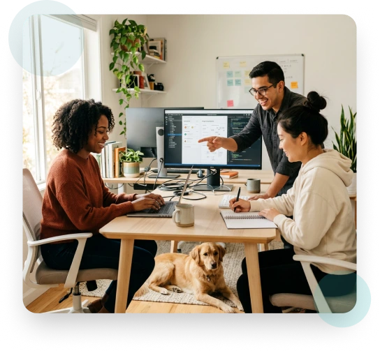 Team collaborating in an office with a dog